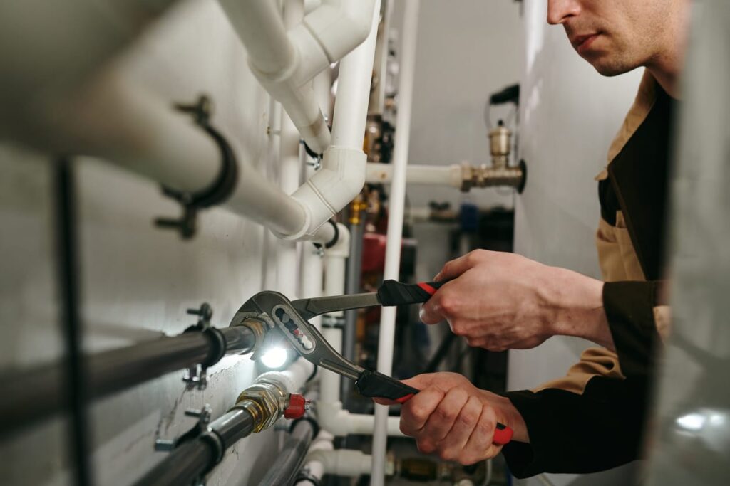 Plumbers maintaining commercial plumbing pipes in Douglasville